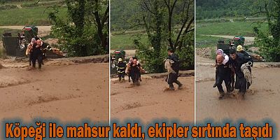 Köpeği ile mahsur kaldı, ekipler sırtında taşıdı